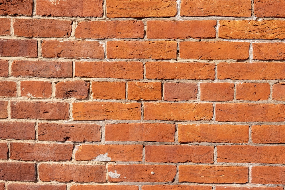 a close up of a red brick wall