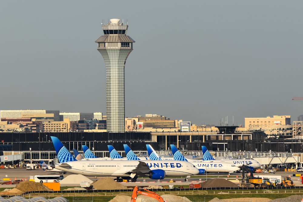 a bunch of airplanes that are sitting in the grass