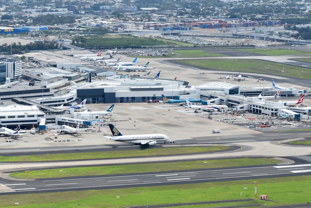 an aerial view of an airport with planes parked