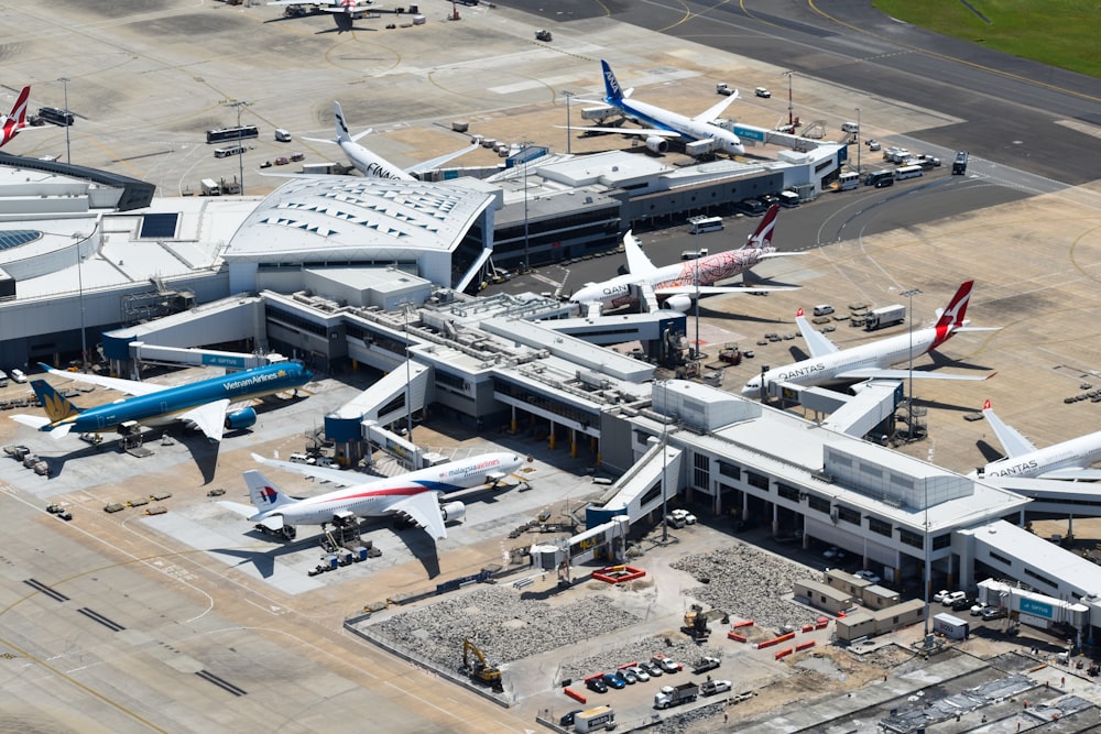 an aerial view of an airport with many planes