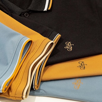 a close up of a polo shirt on a table