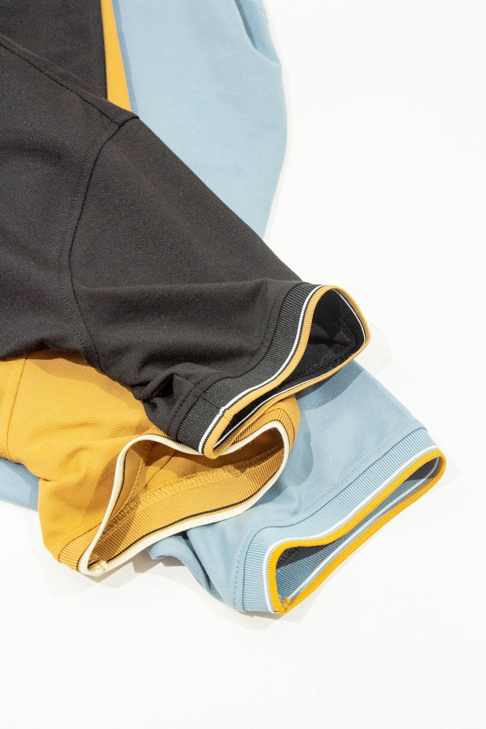 a pair of blue and yellow pants laying on top of each other