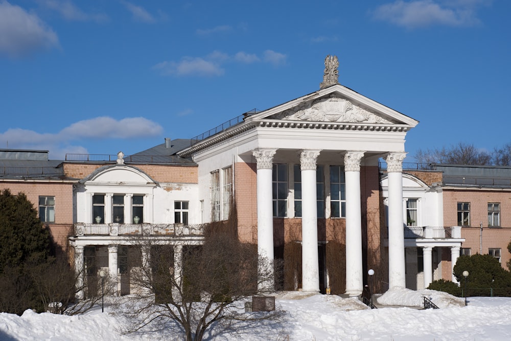 a building with columns in the snow
