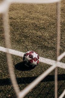 UEFA Euro 2024 soccer ball sitting on top of a soccer field 