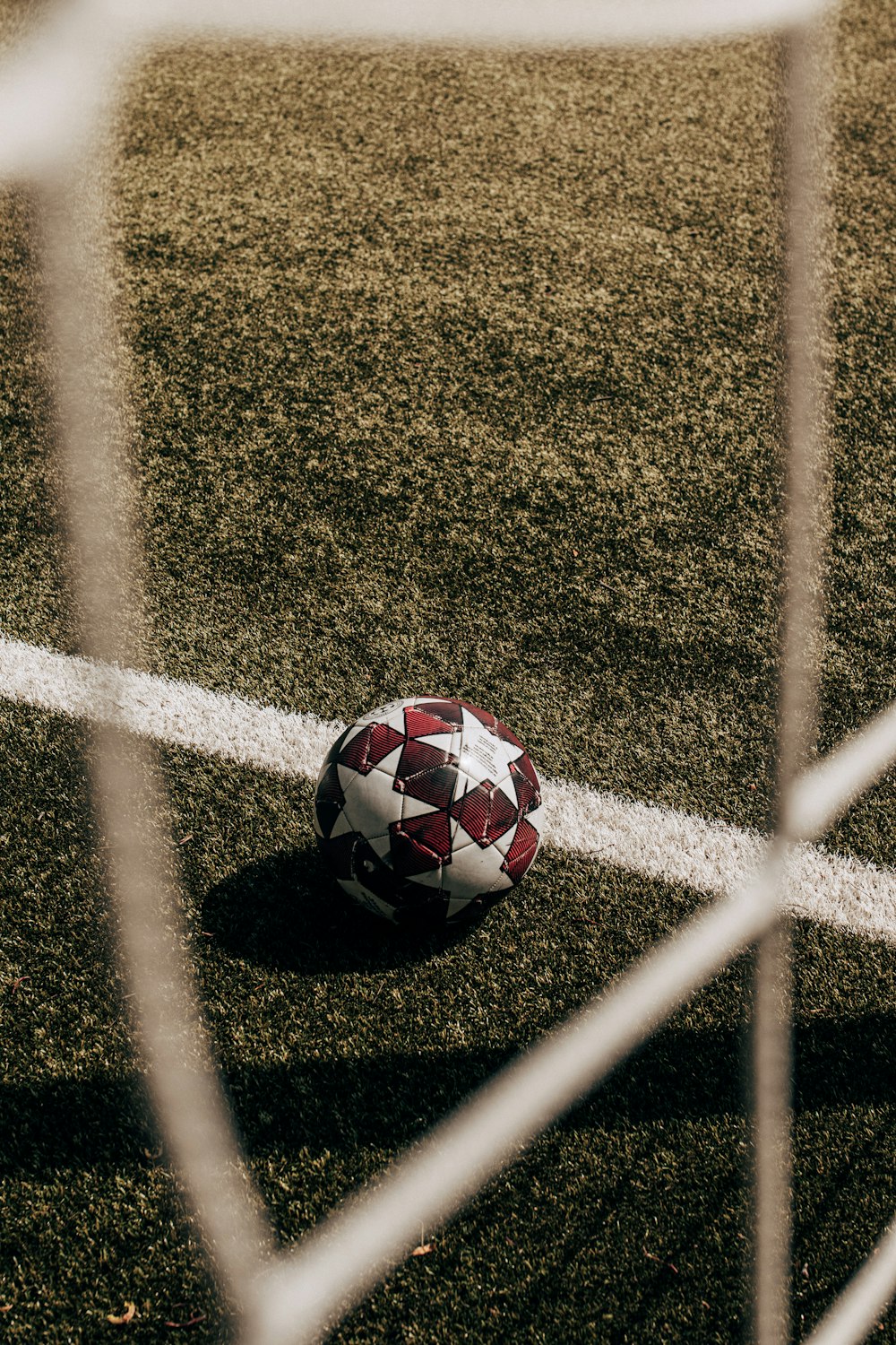 a soccer ball sitting on top of a soccer field