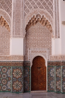 a wooden door in a building with a tiled wall