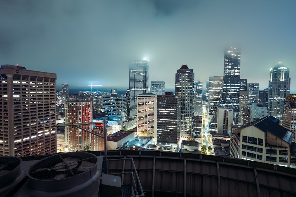 a view of a city at night from the top of a building