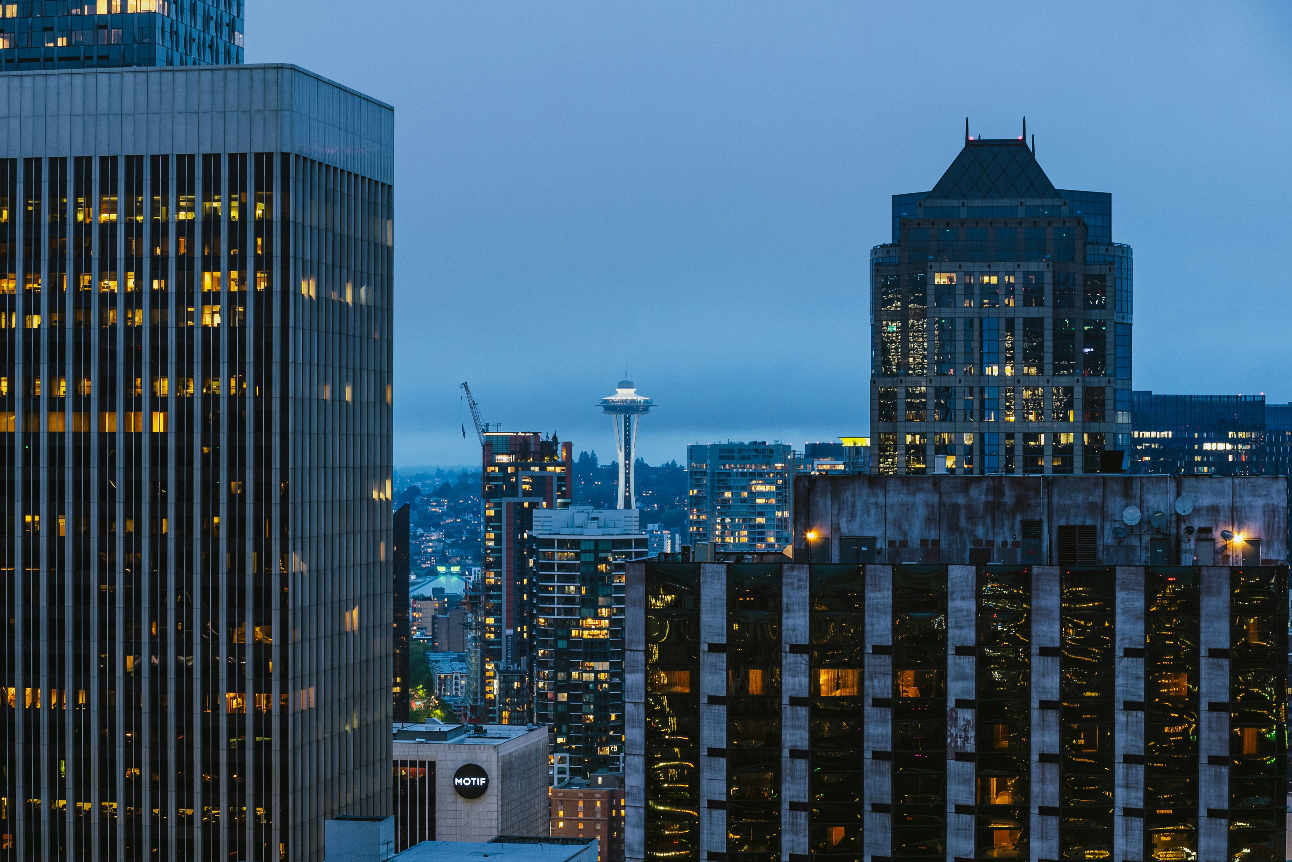 a view of a city at night from the top of a building