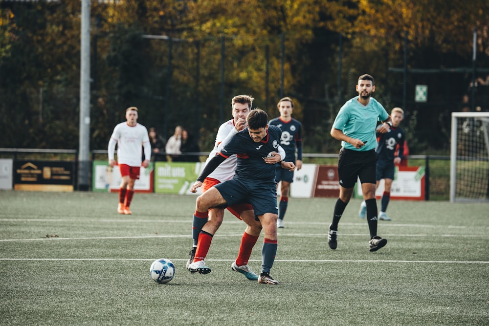 a group of young men playing a game of soccer