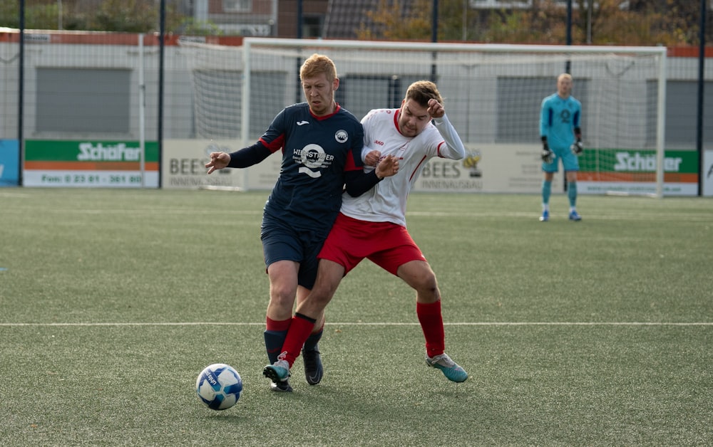 a couple of men playing a game of soccer