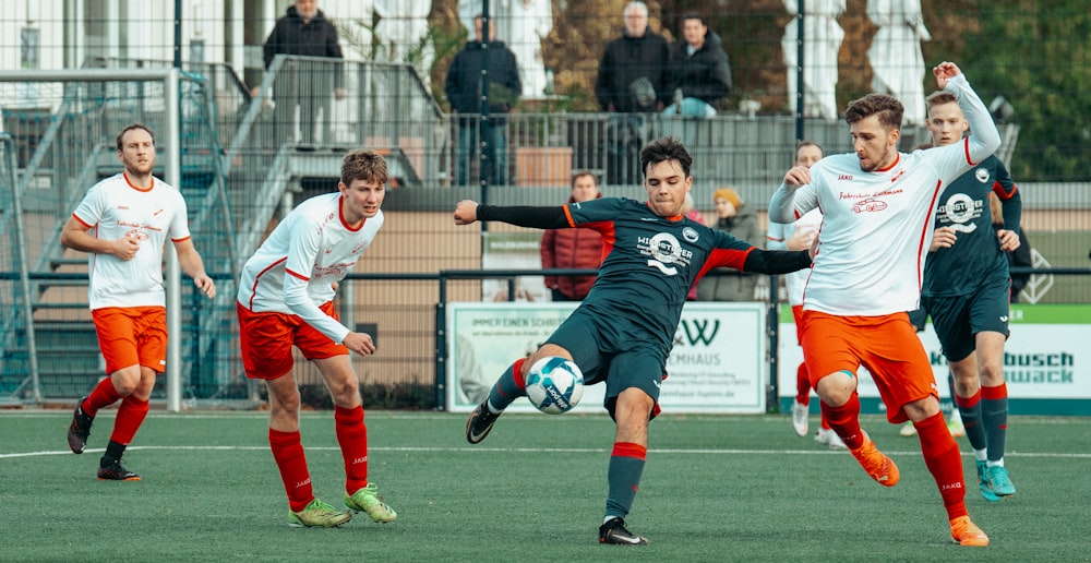 a group of young men playing a game of soccer