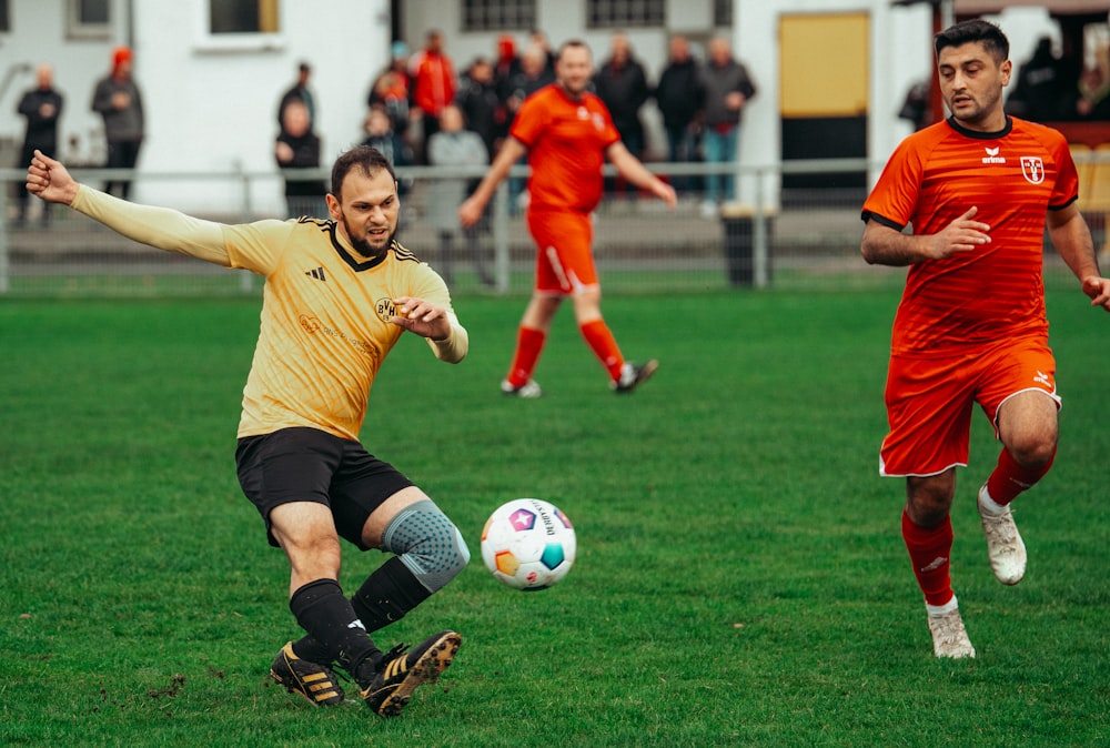 a group of men playing a game of soccer