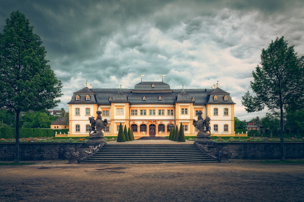 a large building with a lot of trees in front of it