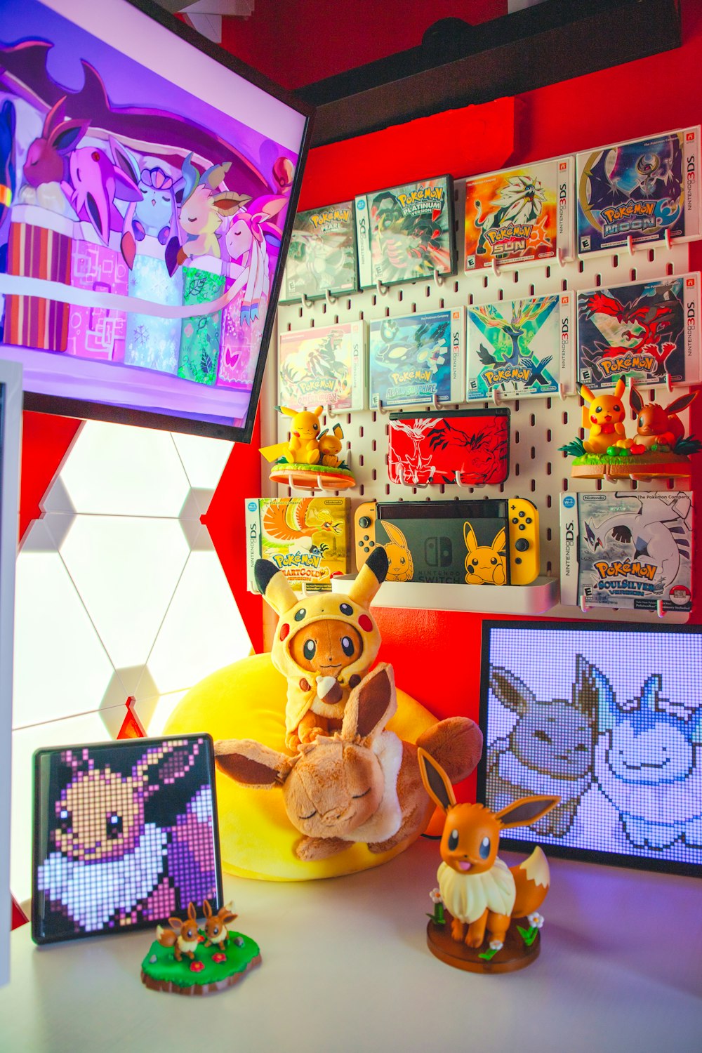 a room filled with pokemon figurines and pictures