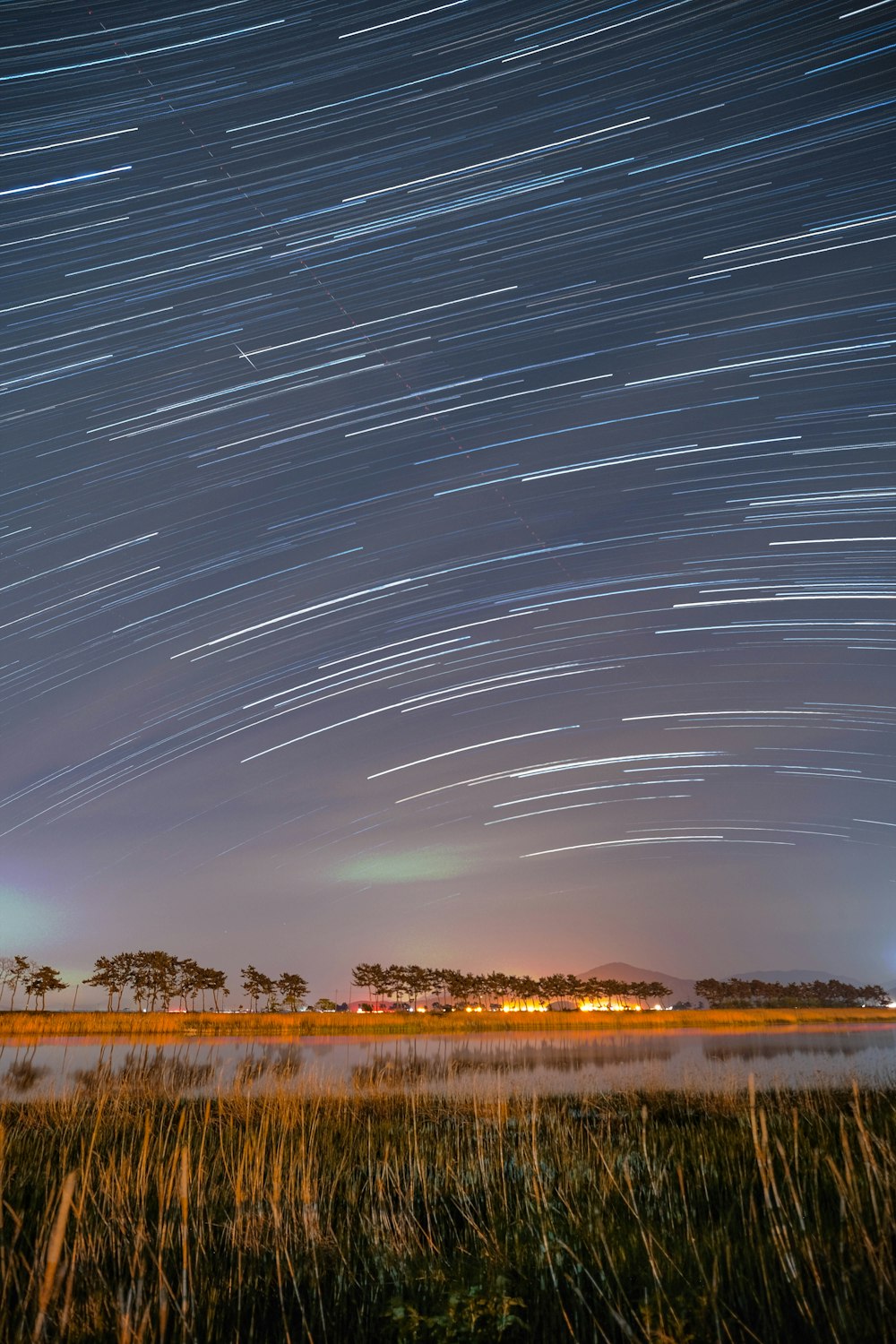 the night sky is filled with star trails