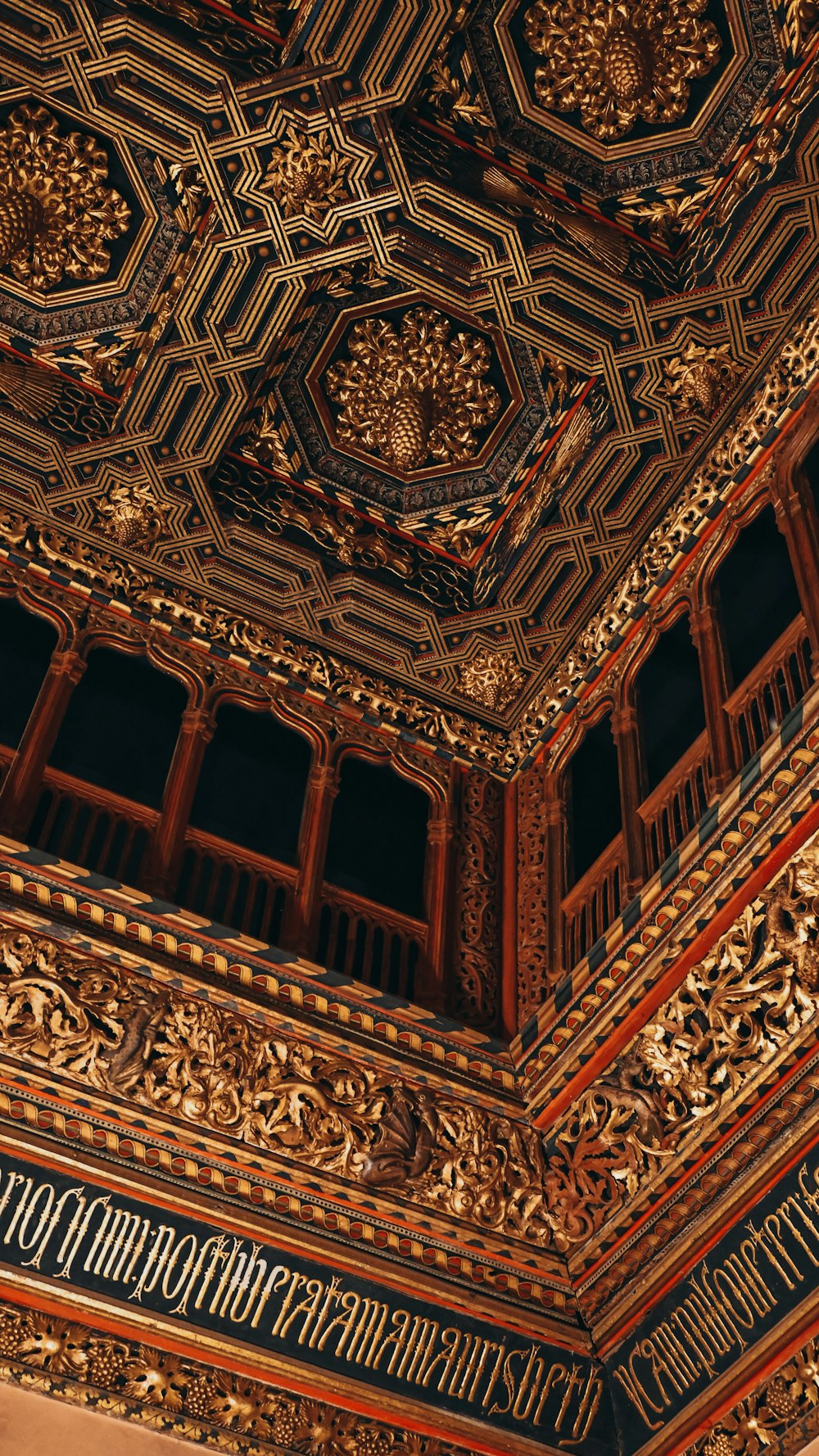 the ceiling of a building with intricate designs