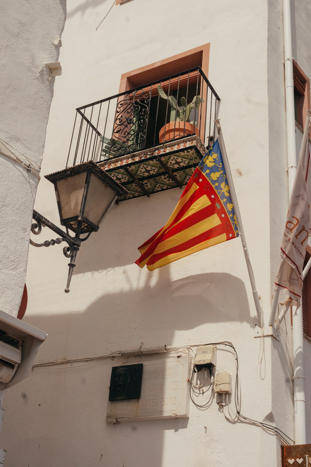 a flag hanging from the side of a building