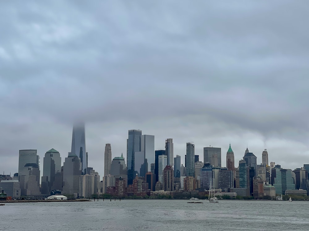 a large body of water with a city in the background