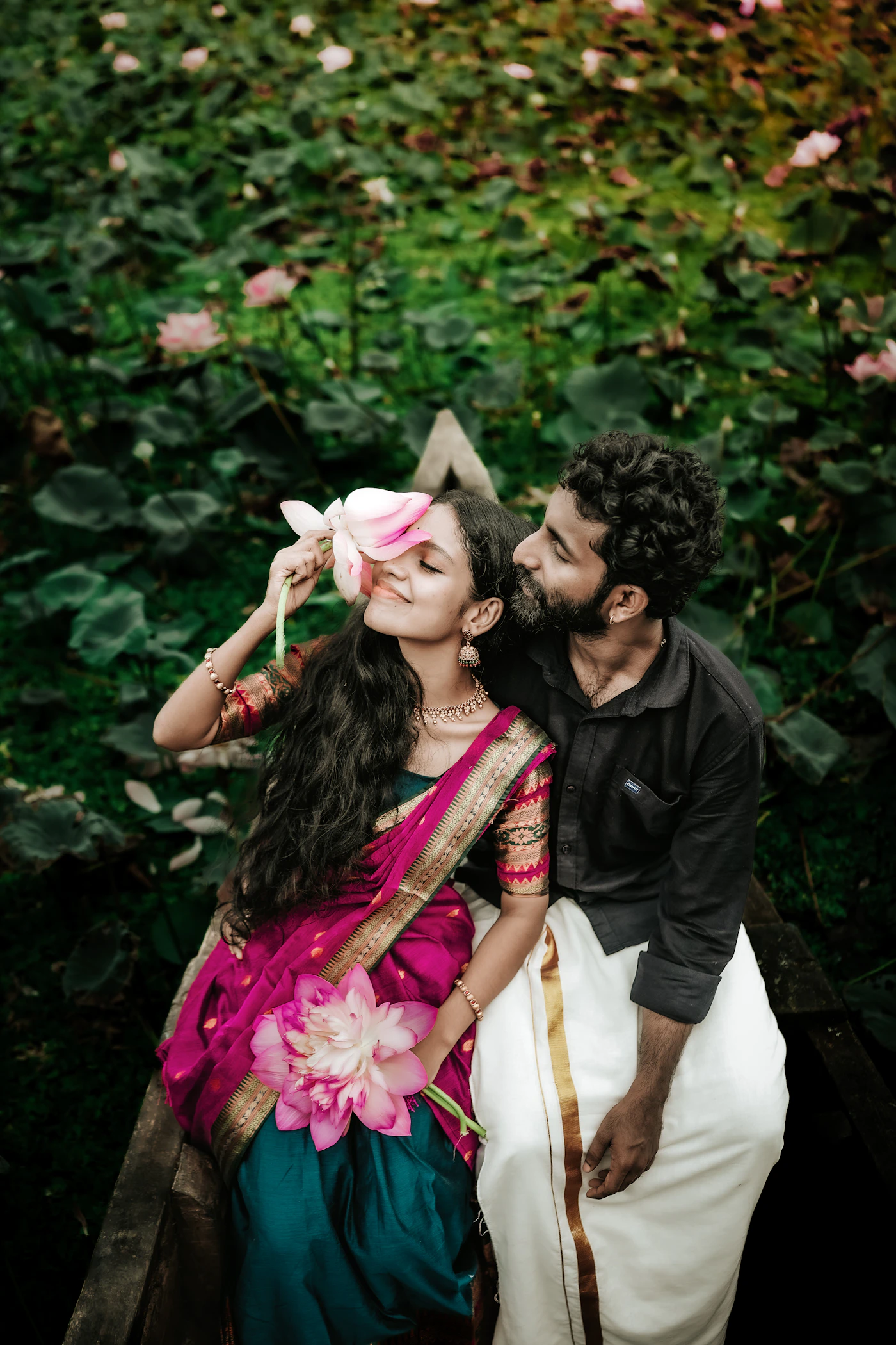 Man kissing a woman on the cheek at a wedding showing the natural intimate moment that documentary wedding photography captures when the couple is genuinely present