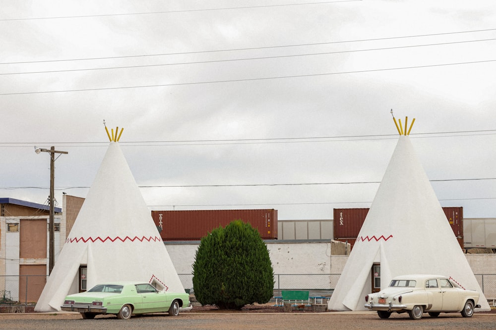 a couple of teepee houses sitting next to each other
