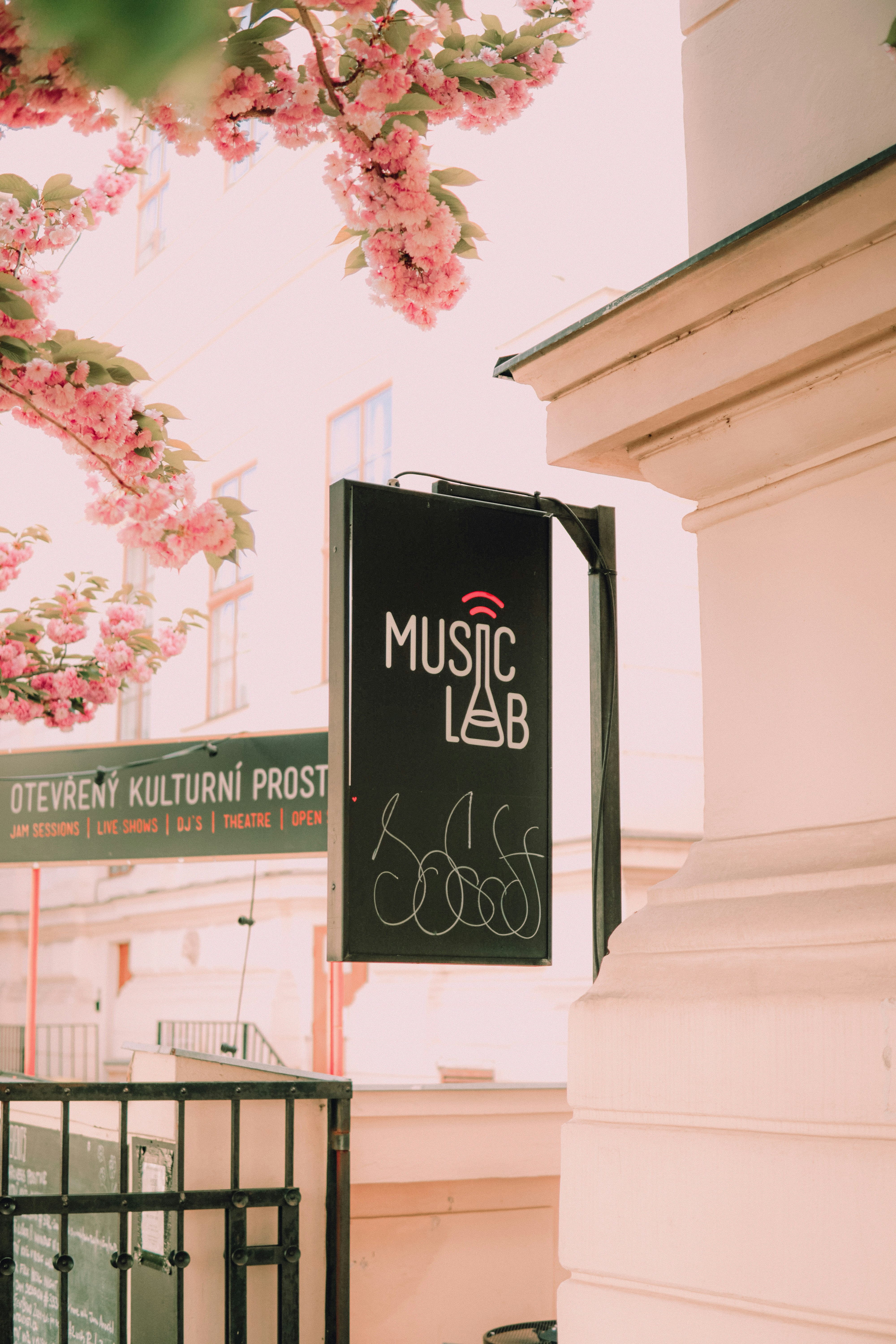 a sign hanging from the side of a building