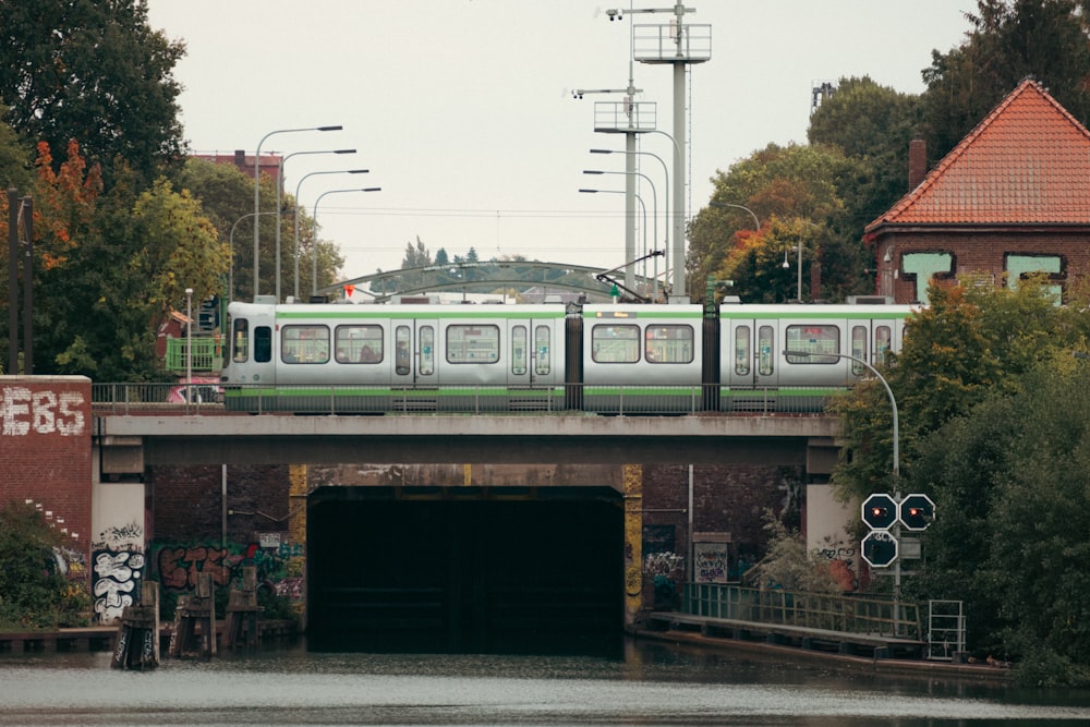 a train traveling over a bridge over a river