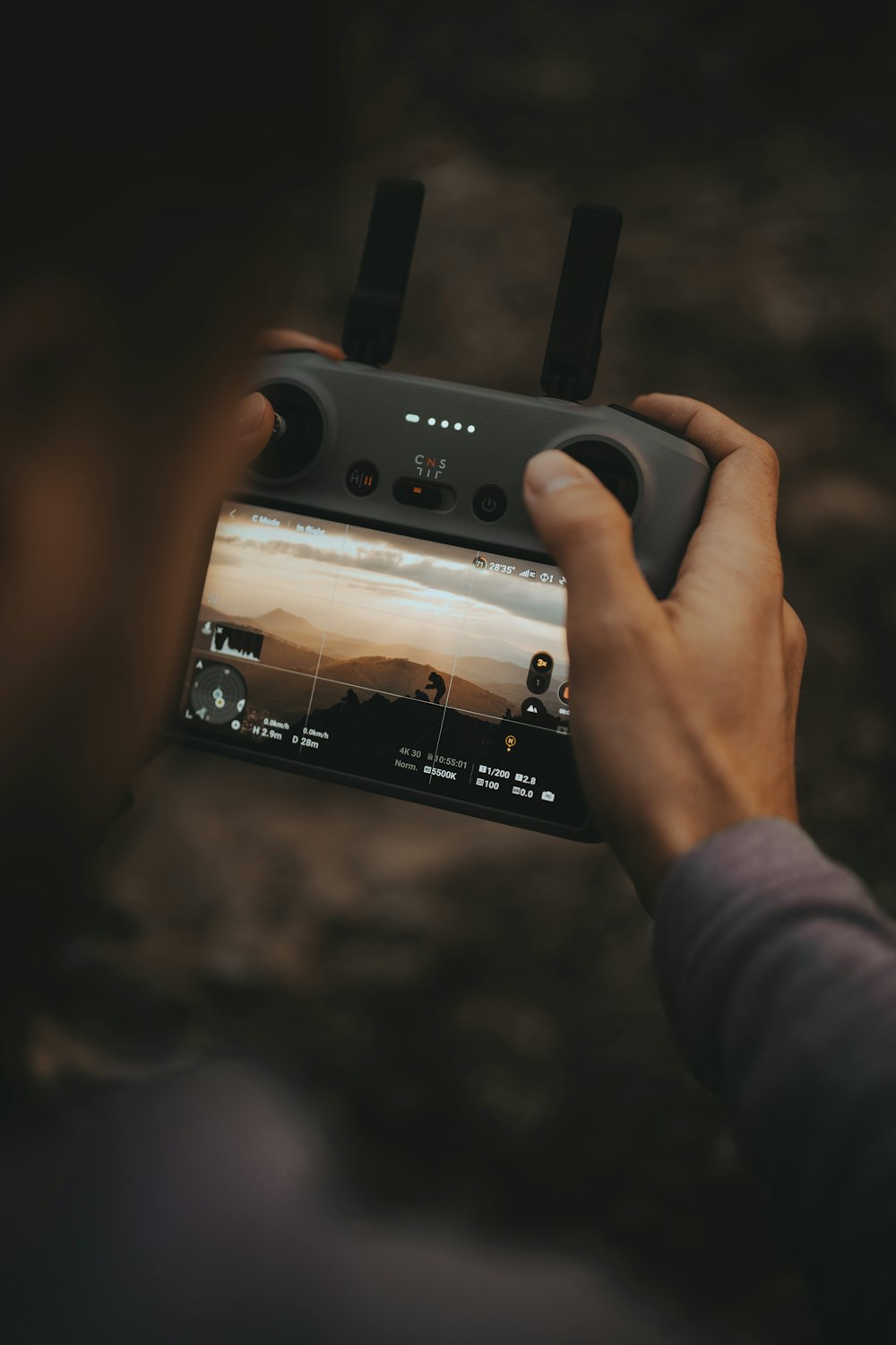 a person holding a video game controller in their hands