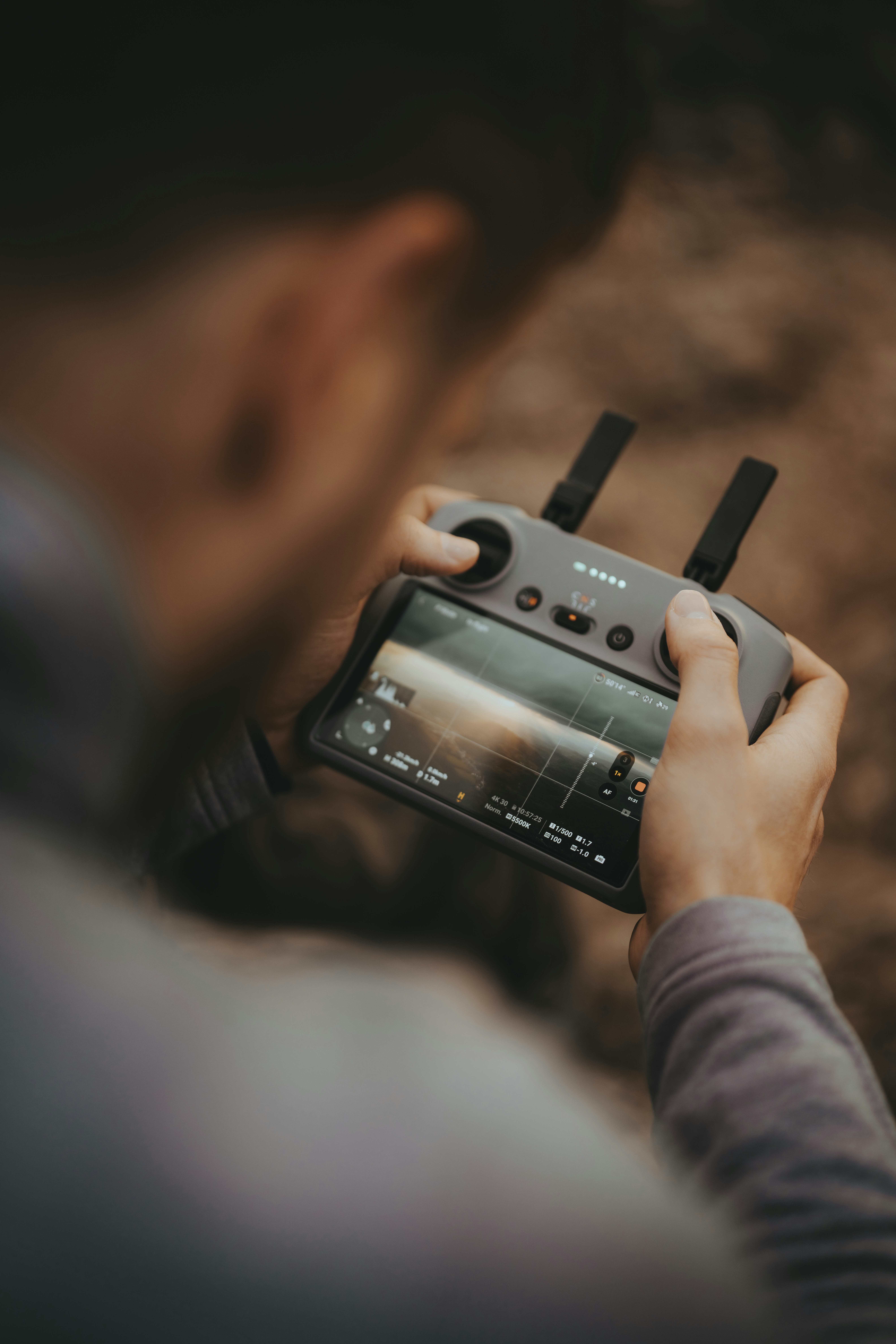 a person holding a camera and recording something