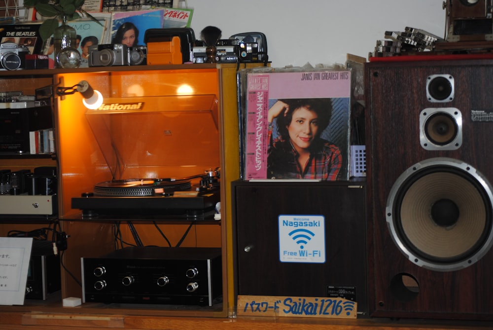 a room filled with speakers and a record player