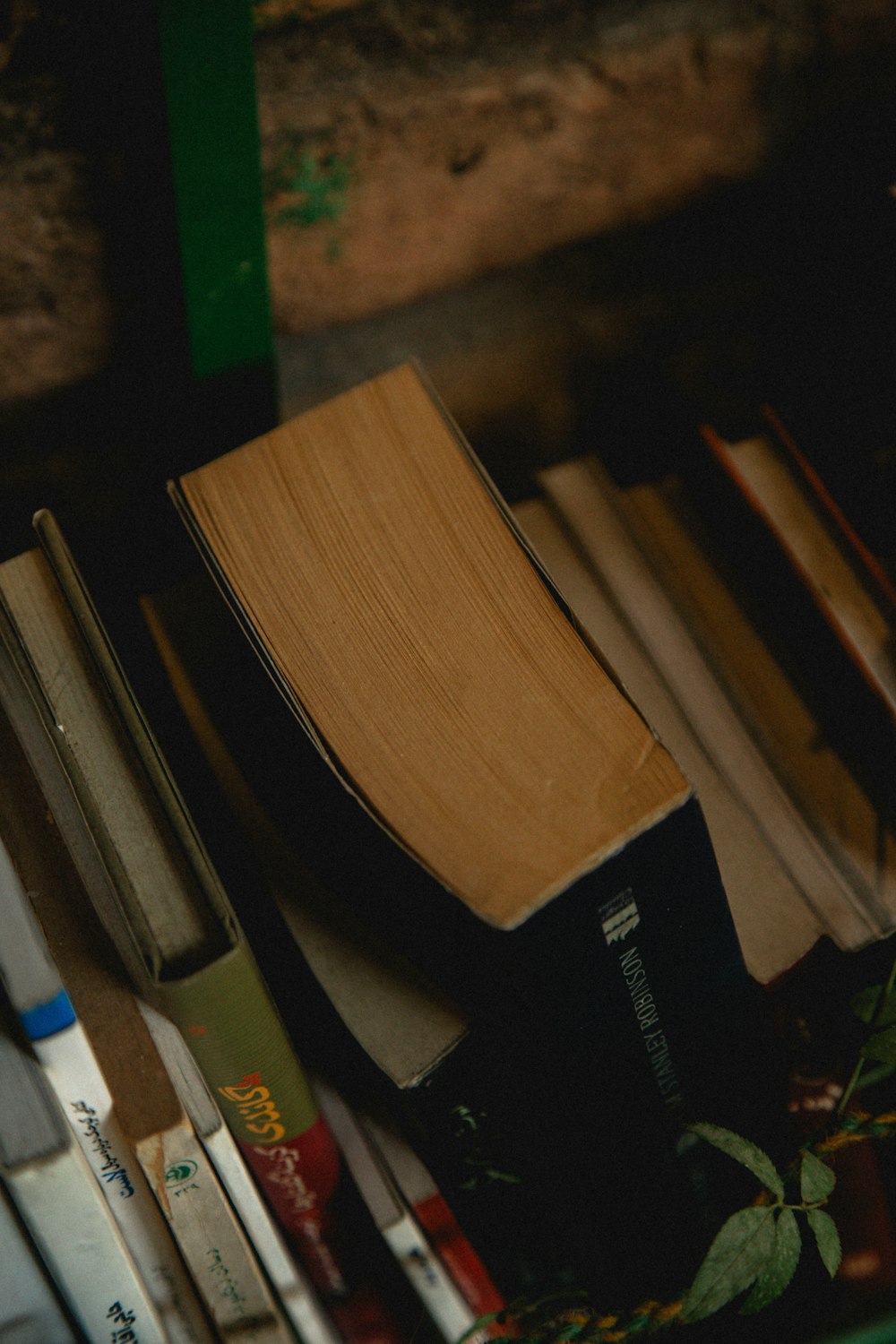 a stack of books sitting on top of a table