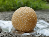 a piece of food sitting on top of a piece of foil
