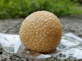 a piece of food sitting on top of a piece of foil