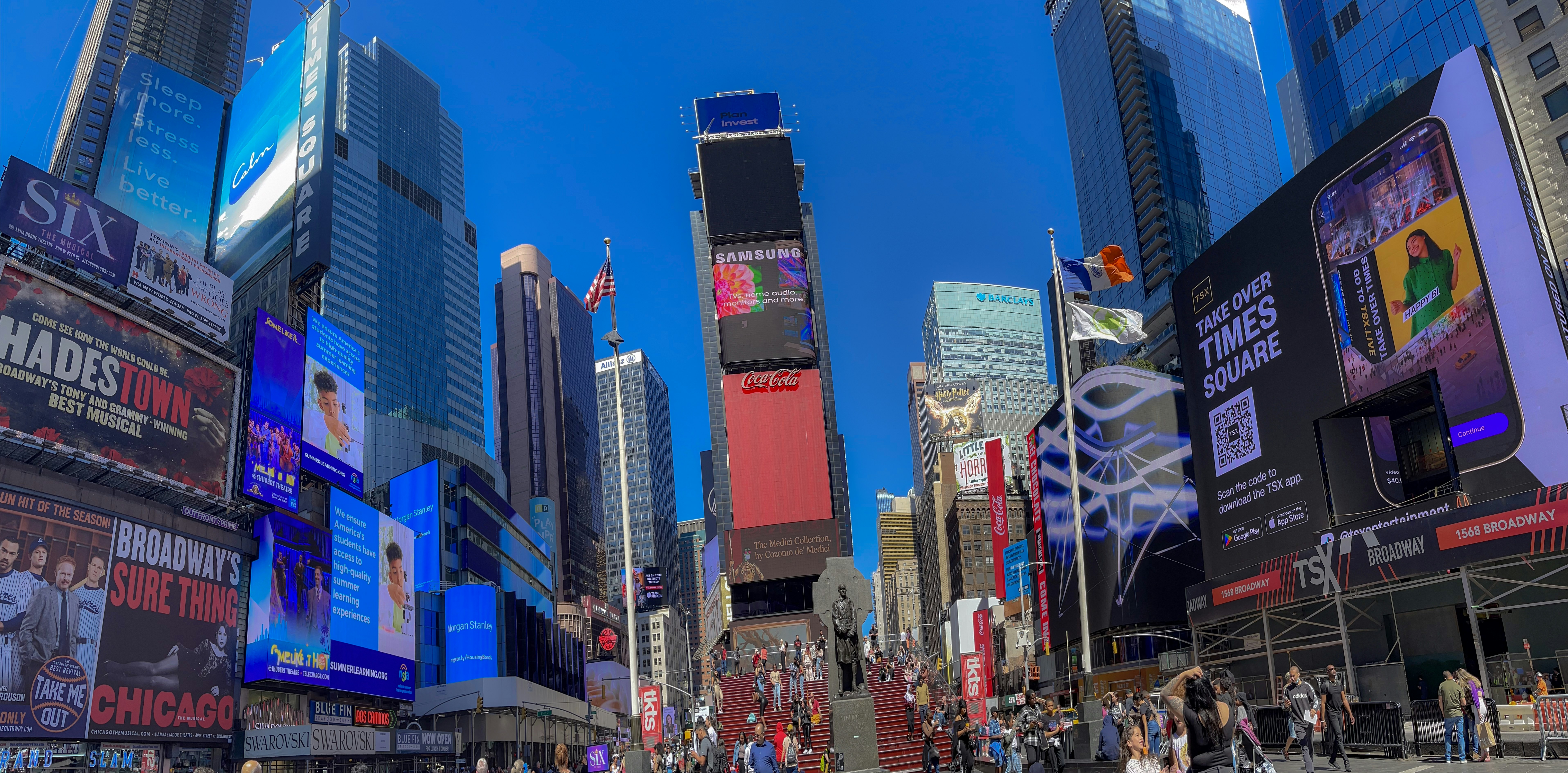 a city street filled with lots of tall buildings