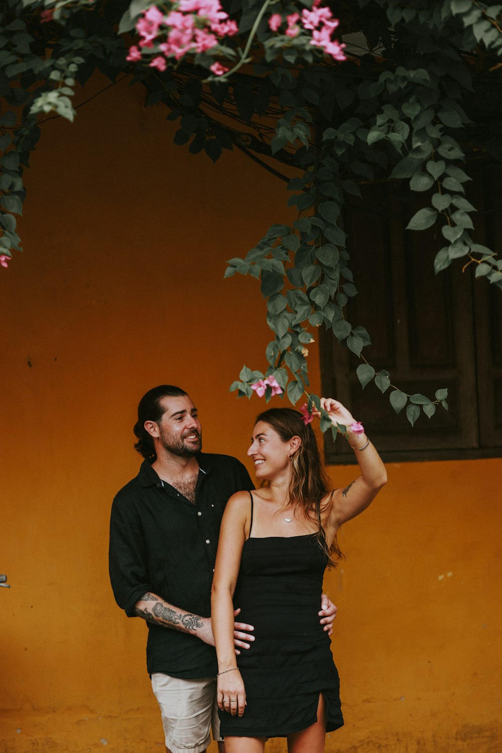 a man and a woman standing next to each other