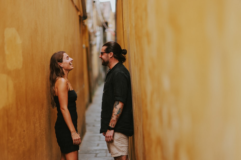 a man and a woman standing next to each other