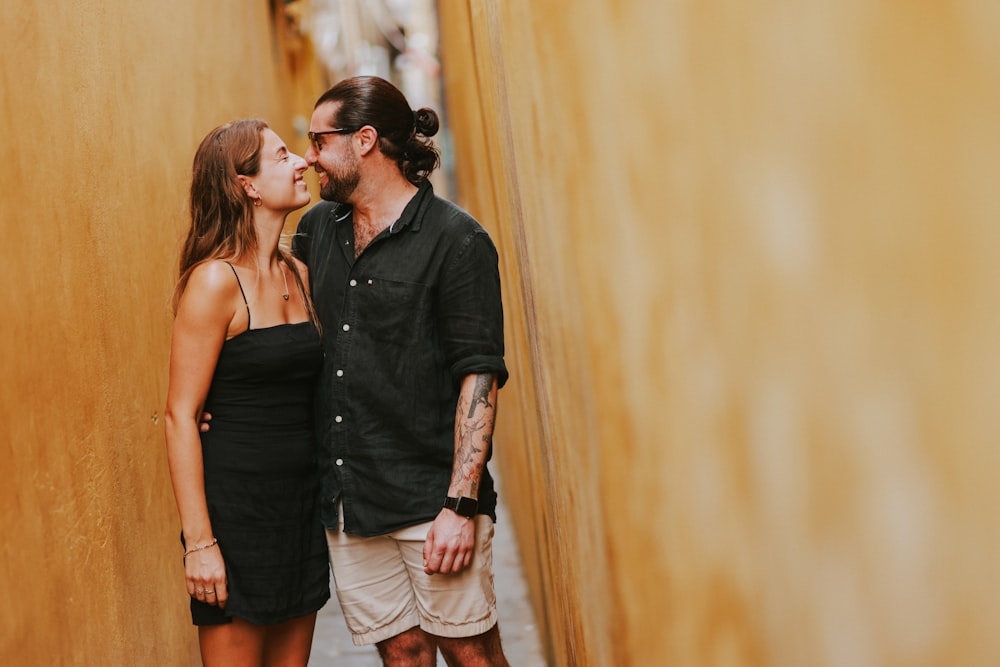 a man and a woman standing next to each other