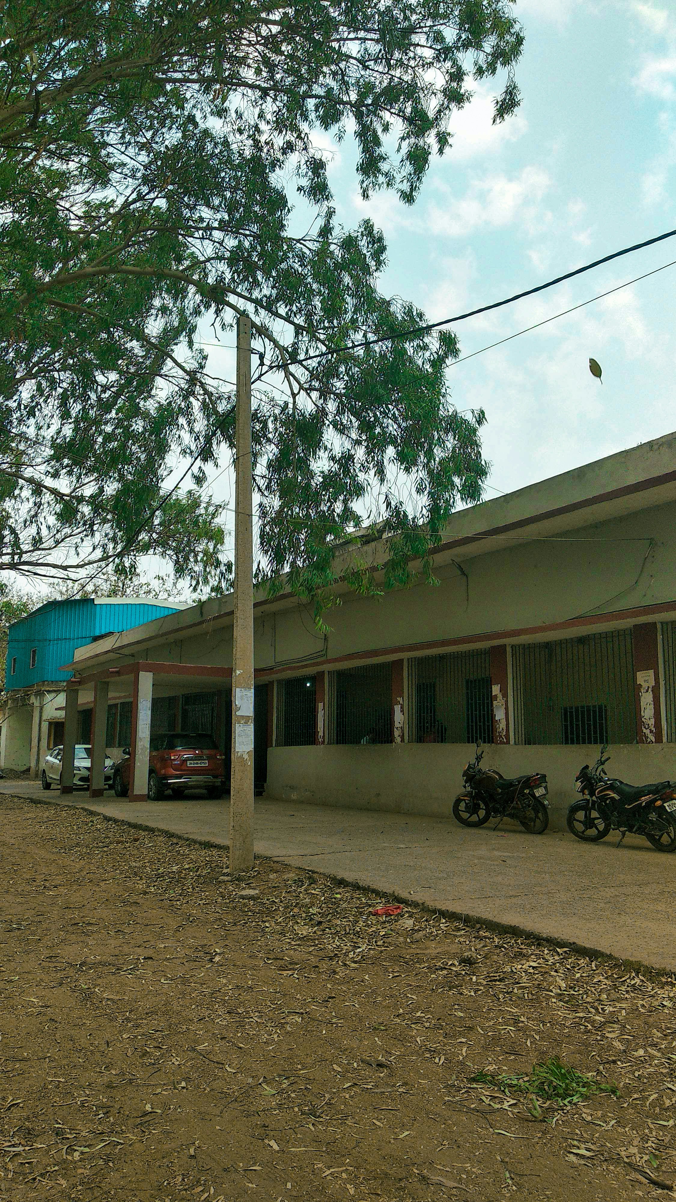 two motorcycles parked in front of a building