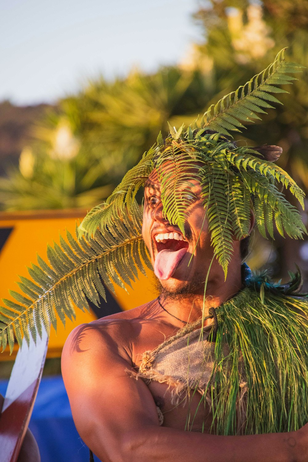 a man with a large green plant on his head