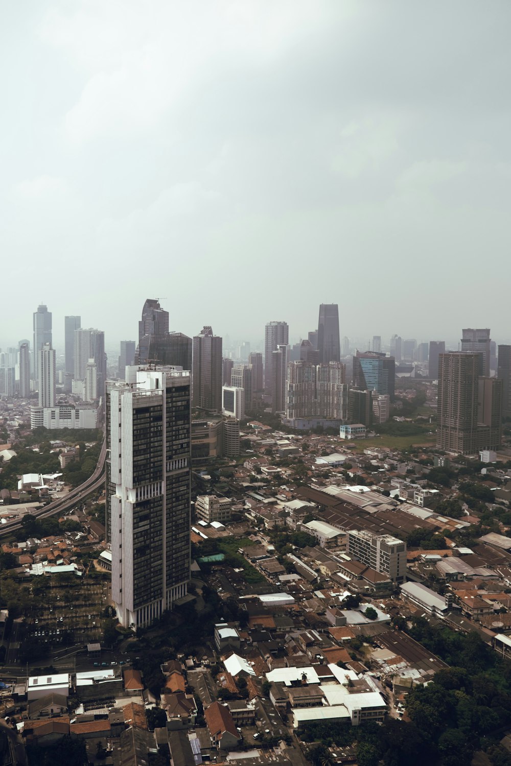 an aerial view of a city with tall buildings