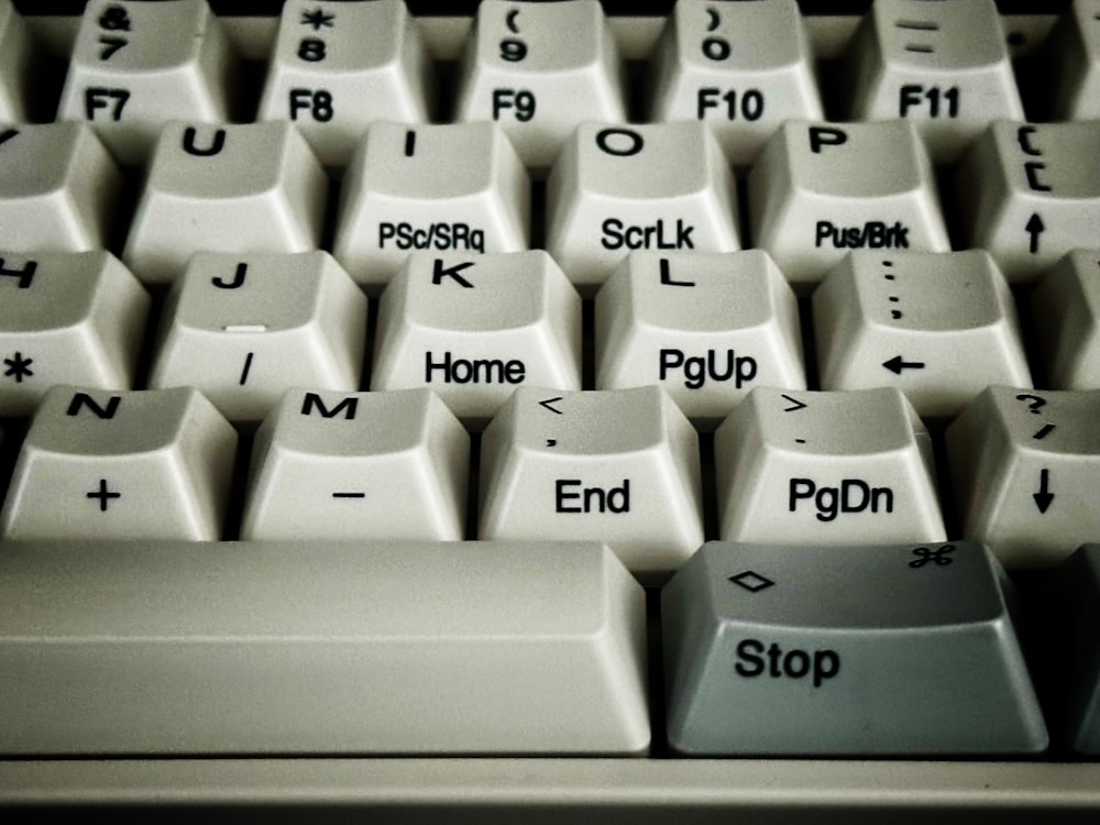 a close up of a keyboard with the word stop on it