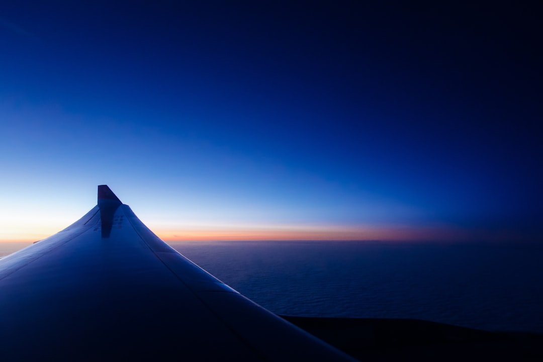 Flying into somewhere exploring the unknown via plane during blue hour