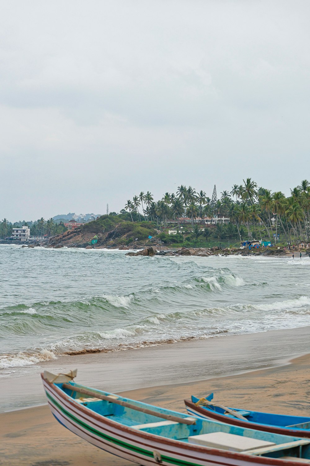 a couple of boats sitting on top of a beach