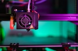 a close up of a machine with a purple light