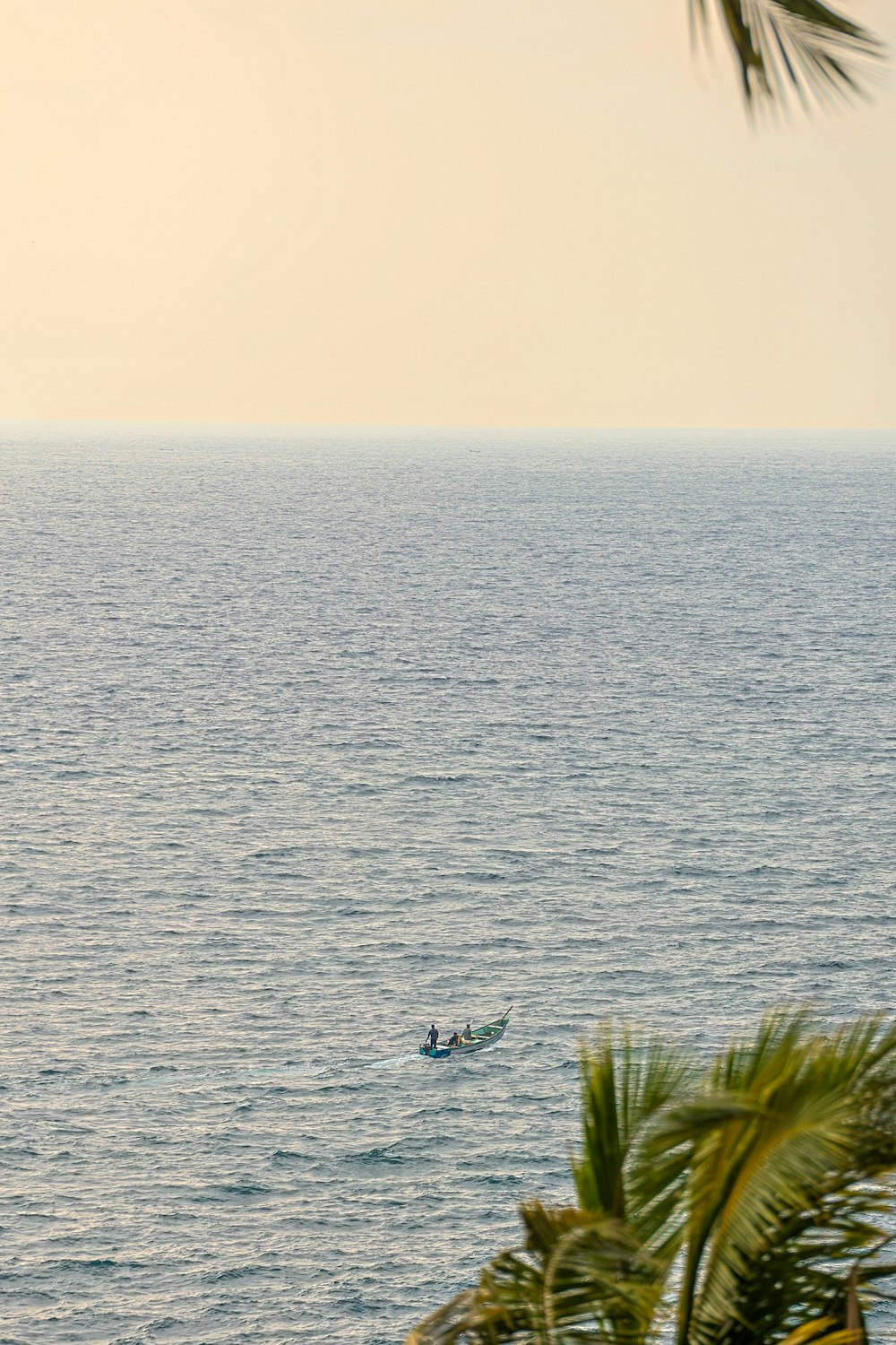 a person in a boat in the middle of the ocean