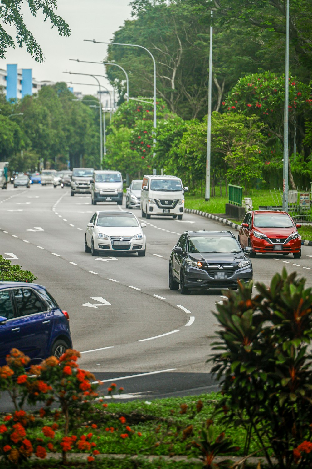 a bunch of cars that are driving down a street