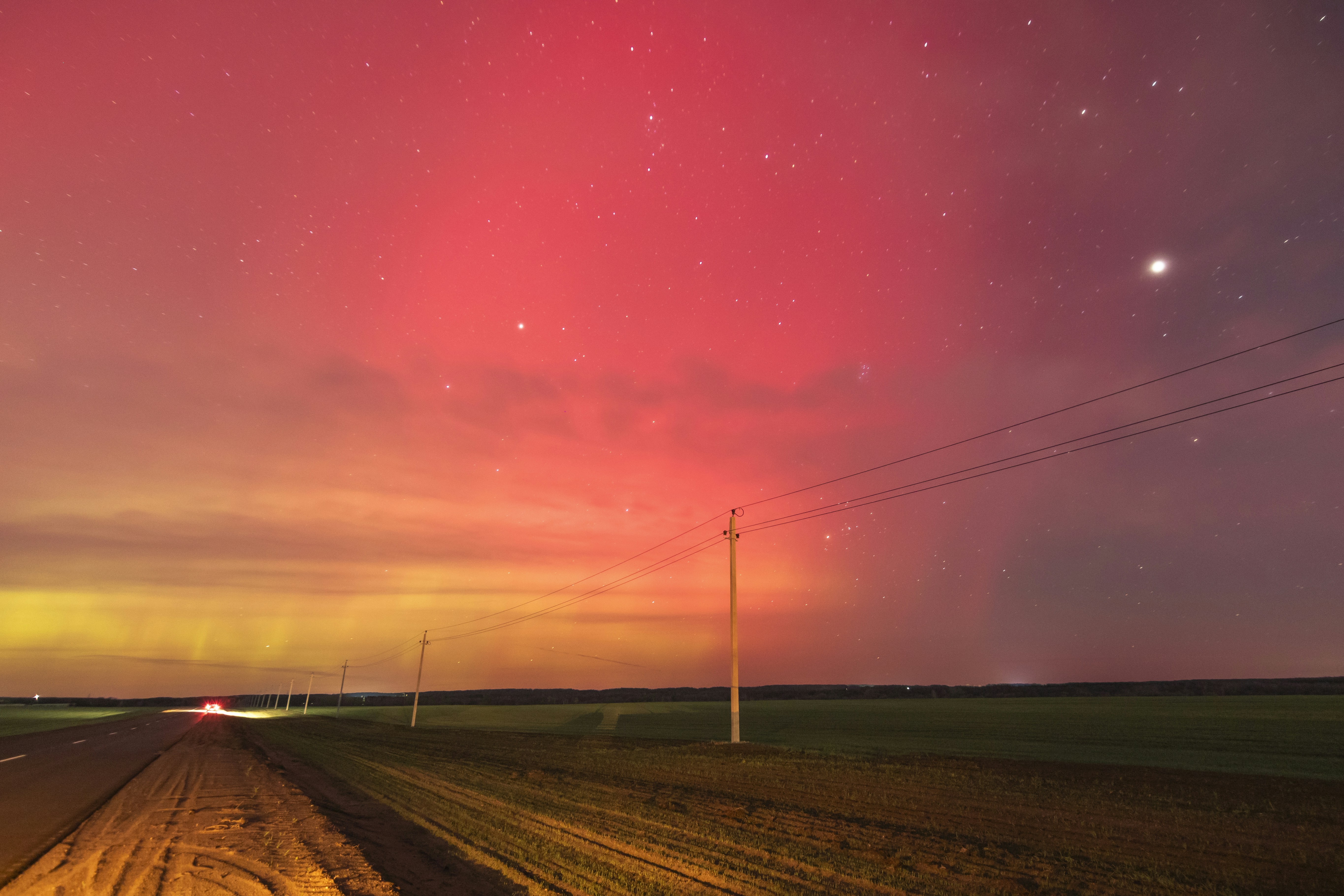 woman wearing yellow long-sleeved dress under white clouds and blue sky during daytime