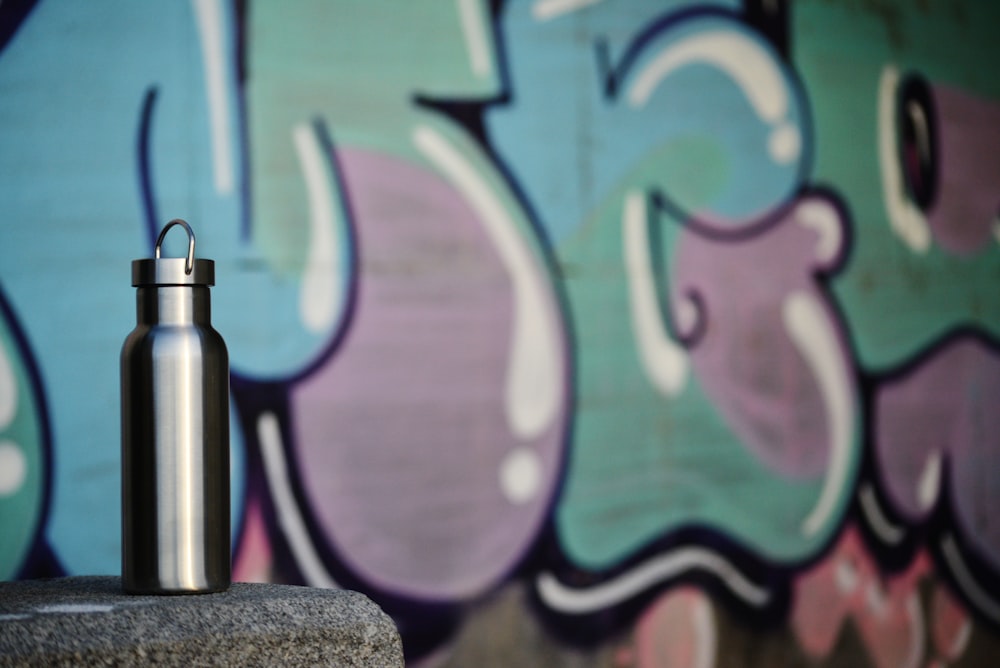 a water bottle sitting on top of a cement block