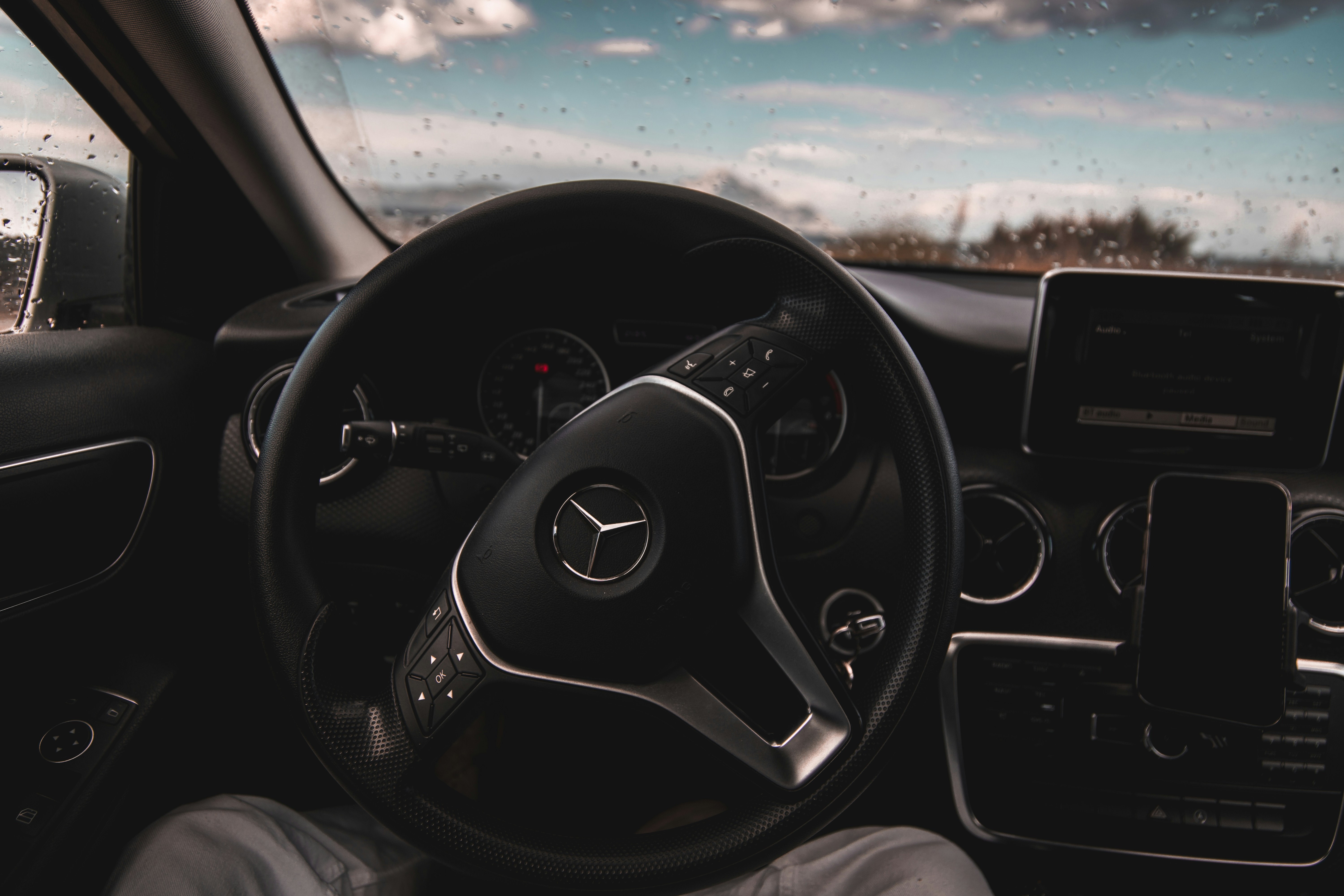 a steering wheel and dashboard of a car
