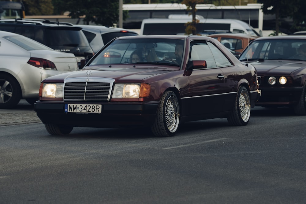 a group of cars that are sitting in the street