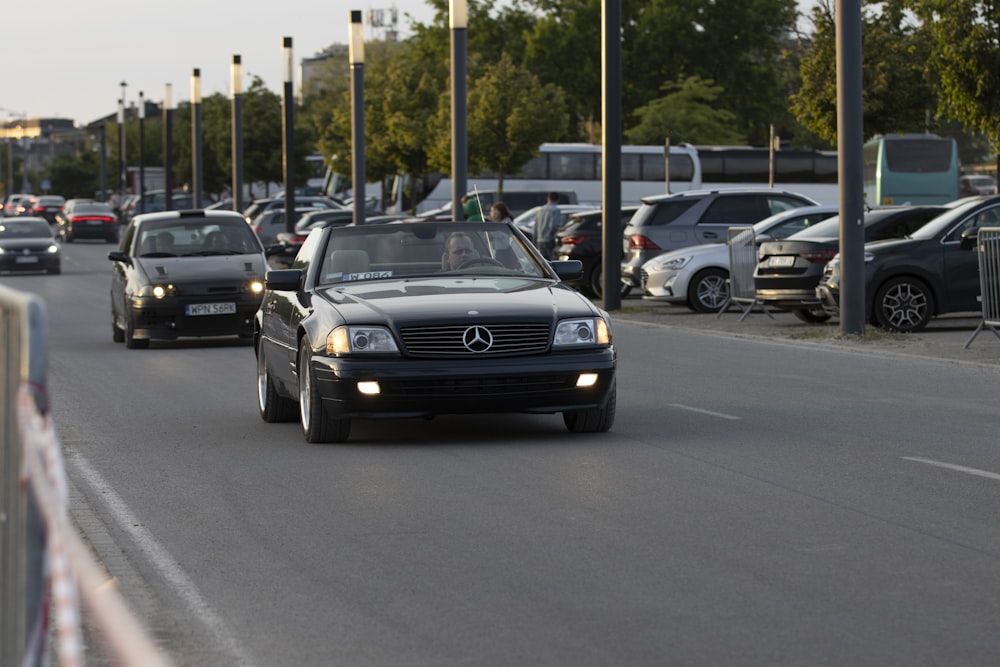 a bunch of cars that are sitting in the street